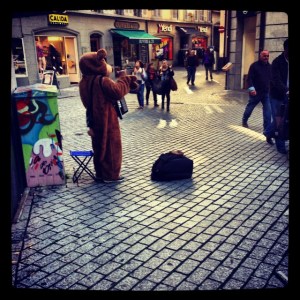 Bear clad accordion player. Lausanne, Switzerland.